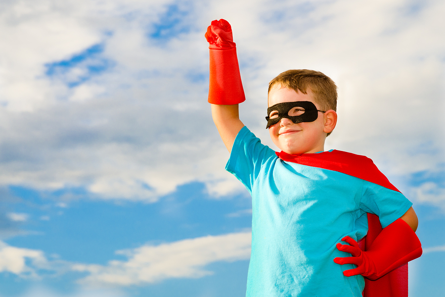 Child pretending to be superhero