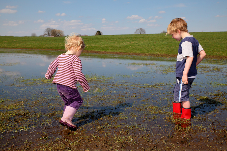 Children in Muddy Pool